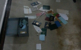 Passports and other documents scattered on the floor