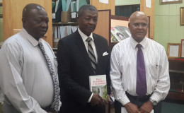 Speaker of the National Assembly Dr Barton Scotland (centre) with Anand Goolsarran (right) and Clerk of the National Assembly Sherlock Isaacs. (Parliament Office photo)