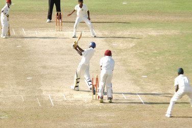 Action between Guyana and the Windwards yesterday’s WICB Regional U15 final round at Providence.