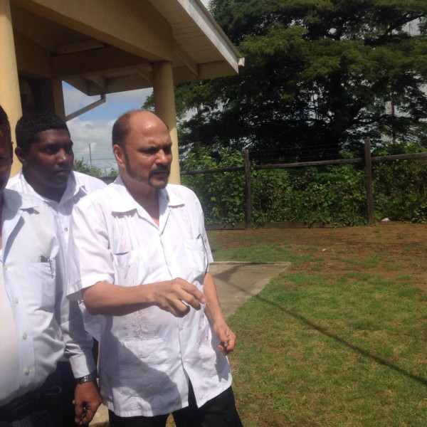 Dr Bheri Ramsaran leaving the Whim Magistrate’s Court yesterday after the charge was read to him. 