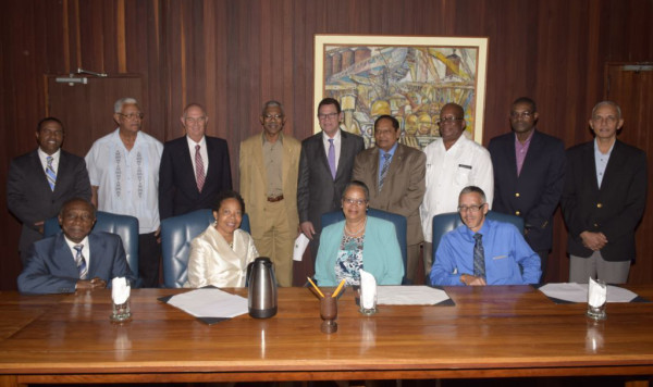 This GINA photo shows President David Granger (fourth from left), the CDB President William Warren Smith (fifth from left) and Prime Minister Moses Nagamootoo (sixth from left) with other members of Cabinet and officials of the bank. 