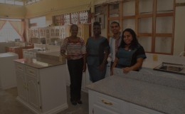 Oriental General Store General Manager Premendra Parsan and three members of the store’s staff 