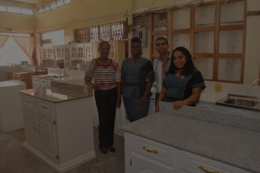 Oriental General Store General Manager Premendra Parsan and three members of the store’s staff 