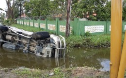 This vehicle ended up on its side in the trench alongside Mandela Avenue just outside President David Granger’s home this morning. It was not immediately clear what caused the accident. 