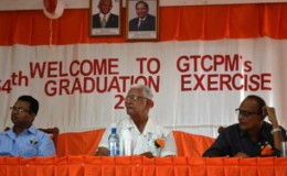 Agriculture Minister  Noel Holder (centre) and GuySuCo’s Chief Executive Officer (ag) Paul Bhim (right) among those at the head table at the corporation’s 54th Apprenticeship Graduation. (GINA photo)