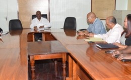 Finance Minister Winston Jordan (centre) and his team, meeting with the PPP’s team on this year’s budget. (GINA photo)