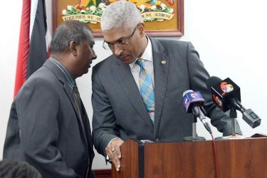 Central Authority Head Netram Kowlessar speaking to T&T AG Garvin Nicholas.