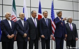Iranian Foreign Minister Mohammad Javad Zarif, Iranian ambassador to IAEA Ali Akbar Salehi, Russian Foreign Minister Sergey Lavrov, British Secretary of State for Foreign and Commonwealth Affairs Philip Hammond, U.S. Secretary of State John Kerry and U.S. Secretary of Energy Ernest Moniz (L-R) prepare for a family photo in Vienna. REUTERS/Leonhard Foeger