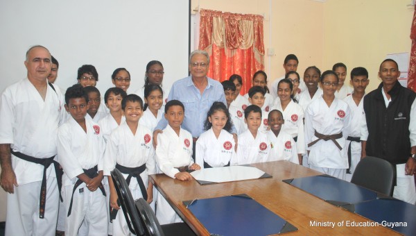 Students of the Guyana Karate College paying a courtesy call on Minister of Education, Dr. Rupert Roopnaraine (centre). Some of the students are heading to the 2015 Karate World Cup in Toronto, Canada on July 15-19.  (Ministry of Education photo)