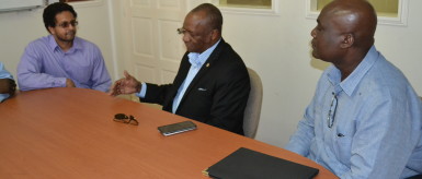 Alexei Ramotar (left) and Minister of State Joseph Harmon (centre) during their recent meeting.