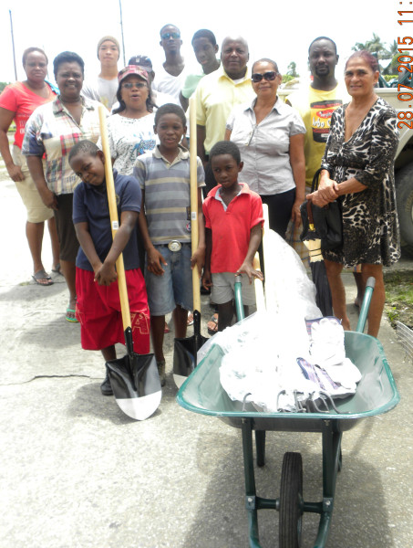 Residents of the Shopping Plaza Community Development Group with their tools.