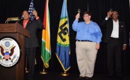  Prime Minister Moses Nagamootoo (left) performing the duties of president, US Chief of Mission, Bryan Hunt (centre) and Minister of State Joseph Harmon toast to the United States’ 239th Independence anniversary last evening at the Marriott Hotel (GINA photo)