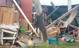 The destroyed shed with the items scattered
