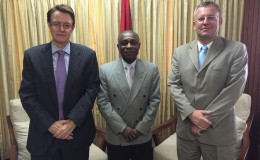 Foreign Minister Carl Greenidge (centre) flanked by EU Ambassador Robert Kopecky and Acting British High Commissioner Ron Rimmer
