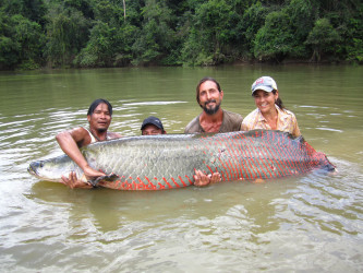 The Rewa team (l to r): Trevor Chan, Jaia Paul, Duane de Freitas Jr, Lesley de Souza engaged with Mr Arapaima.