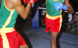 Punches throwing in the action packed bout involving Mickle Sancho (right) and Kevin DeFreitas on Sunday night at the East Ruimveldt Community Centre Ground. (Orlando Charles photo)
