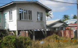The empty house next to Rajindra Persaud’s home that he believes might be serving as a refuge for bandits.
