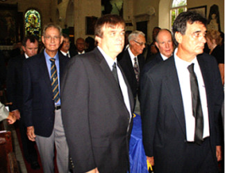 Local cricket commentator Tony Cozier left) was one of the pall bearers to take Short out of the church.
