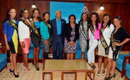 This GINA photo    shows President David Granger and Minister of Tourism, Cathy Hughes (centre), flanked by this year’s delegates, (from left) Miss USA, Jaleesa Peterkin, Miss Barba-dos,  Tanika Walton, Miss, Trinidad and Tobago, Afeya Jeffrey, Miss Suriname, Pricilla Sordam,  (at right), Miss Jamaica, Soyini Phillips, Miss Saint Lucia, Niecer Sussren, Miss Guyana, Cardella Hamilton and reigning Miss Jamzone 2014, Soyini Fraser. The delegates will be participating in the Miss Jamzone 2015 Inter-national Pageant which is slated for Saturday August 15, at the Hits and Jams Water Park, Providence. 