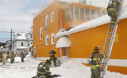 Schenectady firefighters battle the fire at the Bakery after flames  broke out. (Daily Gazette photo)
