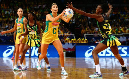 Kim Ravaillion looks to pass past Jamaica’s Paula Thompson during the 2015 Netball World Cup semi-final match between Australia and Jamaica.

