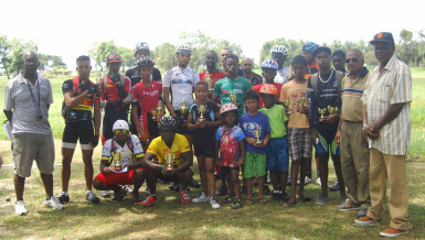 Winners and runners-up of the NSC cycle programme pose with their spoils upon completion of yesterday’s event. (Orlando Charles photo) 