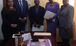 (From left to right) Secretary to the CoI Geeta Chandan-Edmond, Minister of State Joseph Harmon, Commissioner Harold Lutchman, Commissioner Sandra Jones and Magistrate Ann McLennan