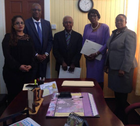 (From left to right) Secretary to the CoI Geeta Chandan-Edmond, Minister of State Joseph Harmon, Commissioner Harold Lutchman, Commissioner Sandra Jones and Magistrate Ann McLennan