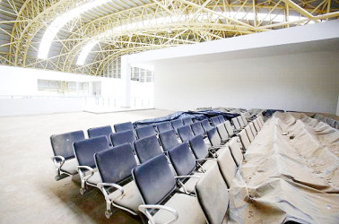 Dust covered seats are pictured inside the lounge of the Jaisalmer Airport in desert state of Rajasthan, India, August 13, 2015.  Reuters/Anindito Mukherjee 