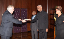 Canadian High Commissioner, Pierre Giroux (left) presenting his Letters of Commission to President David Granger in the presence of Foreign Affairs Minister Carl Greenidge and Acting Director General, Audrey Waddell at the Ministry of the Presidency. (Ministry of the Presidency photo)