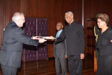 Canadian High Commissioner, Pierre Giroux (left) presenting his Letters of Commission to President David Granger in the presence of Foreign Affairs Minister Carl Greenidge and Acting Director General, Audrey Waddell at the Ministry of the Presidency. (Ministry of the Presidency photo) 