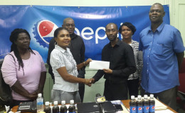 GBA’s Chairman of the Referee/Judges Committee, Ramona Agard receives the sponsorship cheque from DDL’s Larry Wills. They are flanked by (from left) Paulette Nurse (referee/judge) GBA’s president, Steve Ninvalle, GBA’s Secretary Nichola Yhap and the association’s Technical Director, Terrence Poole.
