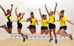 We are the champs! The Guyana female squash team, left to right, Larissa Wiltshire, Akeila Wiltshire, Ashley Khalil, Victoria Arjoon, Ashley DeGroot and Mary Fung-A-Fat celebrating after defeating Barbados in the finale to successfully retain their title in the Cayman Islands yesterday. (Photo compliments of Squashsite.co.uk/casa)
