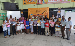 The bursary awardees with senior executives of Banks DIH Limited following the presentation ceremony.
