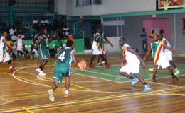 Quacey Lindo of Colts (3rd from right) in the process of challenging an Amelia’s Ward Jets player for possession of the ball during their matchup at the Cliff Anderson Sports Hall