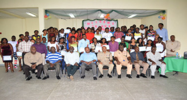 Commissioner of Police, Seelall Persaud and divisional commander, Stephen Mansell and others pose with the graduates