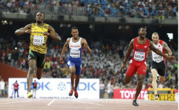 Sprint sweep for brilliant Bolt in Beijing: Usain Bolt of Jamaica (L) crosses the finish line ahead of Justin Gatlin (2nd R) from the U.S., Zharnel Hughes of Britain (2nd L) and Ramil Guliyev of Turkey in the men’s 200m final during the 15th IAAF World Championships at the National Stadium in Beijing, China yesterday.
Reuters/Lucy Nicholson