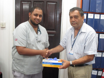 In photo Dr. Aftaab Aliahmad (left) is seen with GPHC’s Chief Executive Officer,  Michael Khan
