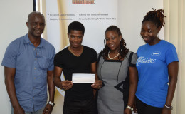 The winner of Guyana Goldfields’ songwriting competition with the members of his Kross Kolor team and AGM Ins’c CRS manager. (From left to right: Chief Executive Officer of Kross Kolor Records Burchmore Simon, arranger and producer at Kross Kolor Records and winner of the competition Simeon Browne,  CRS manager Ayaana Jean-Baptiste, manager of Kross Kolor Records Melissa ‘Vanilla’ Roberts)