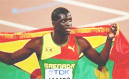 Kirani James celebrates following his bronze medal in the men’s 400m here yesterday.