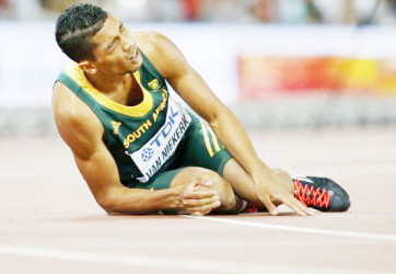 Wayde Van Niekerk of South Africa fades after winning the men’s 400m final during the 15th IAAF World Championships at the National Stadium in Beijing, China August 26, 2015. Reuters/Lucy Nicholson