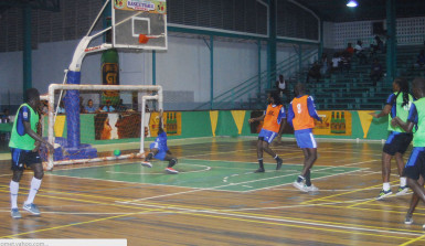 Gerald Gittens (2nd from right) in the process of scoring his side’s third goal during their win over Beterverwagting (BV) in the GT Beer Futsal Championship at the Cliff Anderson Sports Hall 