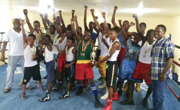 The boxers pose for a photo in the ring with president of the GBA Steve Ninvalle (extreme left) and Guyana’s lone Olympic medalist, Mike Parris (extreme right).
