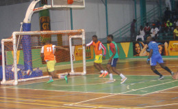 Dwayne Lawrence (no.11) of Festival City scoring the fastest goal in the tournament in 18 seconds during his team’s victory against Kitty Weavers in the GT Beet Futsal Championship
