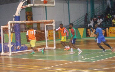 Dwayne Lawrence (no.11) of Festival City scoring the fastest goal in the tournament in 18 seconds during his team’s victory against Kitty Weavers in the GT Beet Futsal Championship 