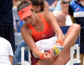 Ana Ivanovic of Serbia treats a blister while playing Dominika Cibulkova of Slovakia on day one of the 2015 US Open tennis tournament at USTA Billie Jean King National Tennis Center yesterday. Mandatory Credit: Robert Deutsch-USA TODAY Sports. 