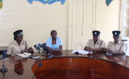 Constable Laurel Gittens, Superintendent of Training, (at left) addresses reporters yesterday while acting City Hall spokesperson Debra Lewis (second from left) and senior members of the constabulary look on. (Photo by Keno George)
