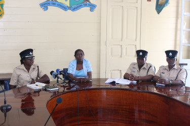 Constable Laurel Gittens, Superintendent of Training, (at left) addresses reporters yesterday while acting City Hall spokesperson Debra Lewis (second from left) and senior members of the constabulary look on. (Photo by Keno George) 