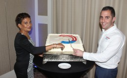 Rentokil Initial General Manager Margaret Humphrey and Rentokil Initial Area Director (Caribbean) Stephen Frost cutting the company’s 50th anniversary cake. (Photo by Keno George)