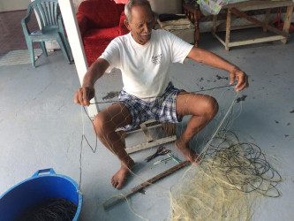  Seerajeo Persaud knitting a fishnet 